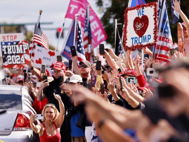 WEST PALM BEACH, FLORIDA - JANUARY 20: Supporters wave to outgoing US President Donald Trump as he returns to Florida along the route leading to his Mar-a-Lago estate on January 20, 2021 in West Palm Beach, Florida. Trump, the first president in more than 150 years to refuse to attend …
