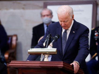 US President Joe Biden delivers remarks near the casket of former US Senate Majority Leader Bob Dole, who died on Sunday, during a congressional ceremony to honor Dole, who lies in state in the US Capitol Rotunda in Washington,DC on December 9, 2021. (Photo by JONATHAN ERNST / POOL / …