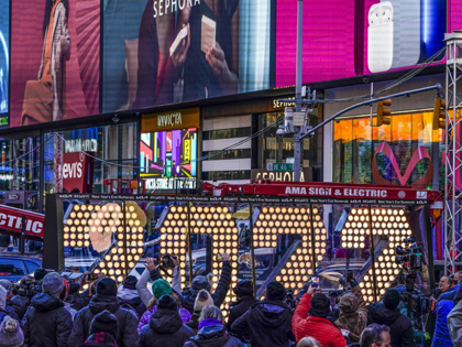 The 2022 sign that will be lit on top of a building on New Year's Eve is displayed in Times Square, New York, Monday, Dec. 20, 2021. New York City is readying to embrace the new year by reviving its annual New Year's Eve celebration in Times Square—limiting the number …