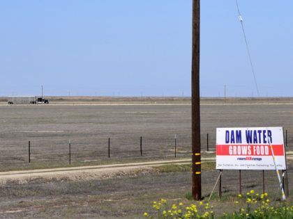 A sign calls for dam water to help the agricultural communities of California's San Joaqui