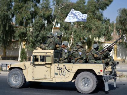aliban forces from the Al-Badr military corps sit on armed vehicles during a parade in Kandahar on November 8, 2021. (Photo by Javed TANVEER / AFP) (Photo by JAVED TANVEER/AFP via Getty Images)