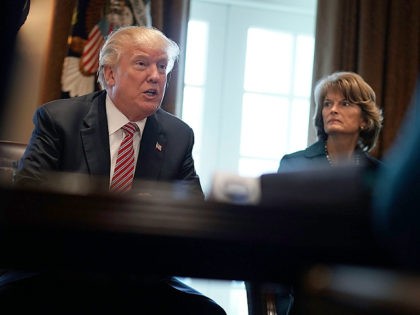 WASHINGTON, DC - FEBRUARY 14: U.S. President Donald Trump (L) speaks as Sen. Lisa Murkowski (R-AK) (R) looks on during a meeting with congressional members at the Cabinet Room of the White House February 14, 2018 in Washington, DC. President Trump held a meeting with congressional members to discuss the …