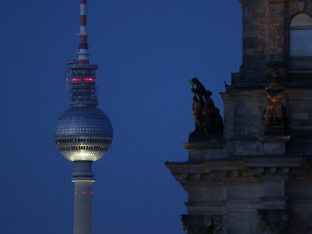 BERLIN, GERMANY - JULY 12: The broadcast tower at Alexanderplatz is seen behind a statue adorning the Reichstag on July 12, 2021 in Berlin, Germany. The tower is among Berlin's most famous landmarks. (Photo by Sean Gallup/Getty Images)