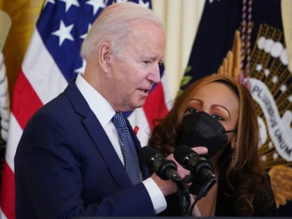 WASHINGTON, DC - DECEMBER 01: U.S. President Joe Biden hugs Marguerite Wheeler-Lara, the mother of CEO and Founder of TruEvolution Gabriel Maldonado, during his remarks to commemorate World AIDS Day at the White House on December 01, 2021 in Washington, DC. Biden announced the launch of the new National HIV/AIDS …