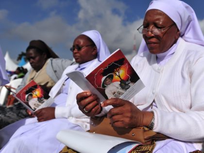 Catholic nuns attend the beatification ceremony for a missionary nun, Sister Irene Stefani, who died in 1930 while working in the region, in Nyeri, 150km from the capital Nairobi, on May 23, 2015. Tens of thousands of Catholics prayed in the Kenyan town of Nyeri at a beatification ceremony of …