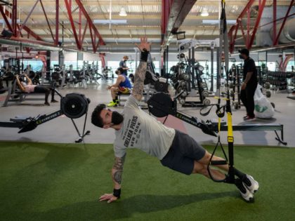 People work out at a gym in Manhattan, New York city on May 19, 2021. - Governor Andrew Cu