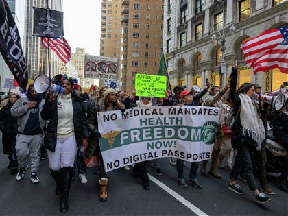 Demonstrators march during an anti-mandate protest against the Covid-19 vaccine as part of a 'Global Freedom Movement' in New York on November 20, 2021. (Photo by Yuki IWAMURA / AFP) (Photo by YUKI IWAMURA/AFP via Getty Images)