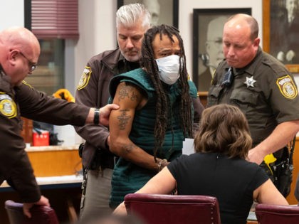 WAUKESHA, WISCONSIN - NOVEMBER 21: Darrell Brooks (C) appears at Waukesha County Court on November 23, 2021 in Waukesha, Wisconsin. Brooks is charged with killing five people and injuring nearly 50 after driving through a Christmas parade with his sport utility vehicle on November 21. (Photo by Mark Hoffman-Pool/Getty Images)