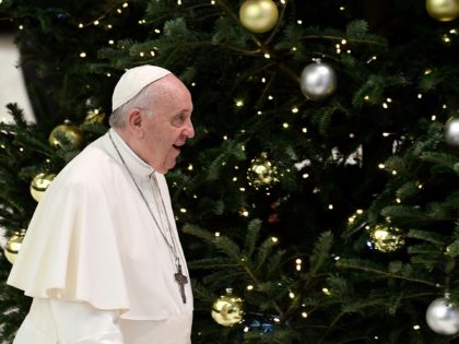 Pope Francis walks by a Christmas tree during the general audience at the Paul VI Hall at the Vatican on December 01, 2021. (Photo by Filippo MONTEFORTE / AFP) (Photo by FILIPPO MONTEFORTE/AFP via Getty Images)