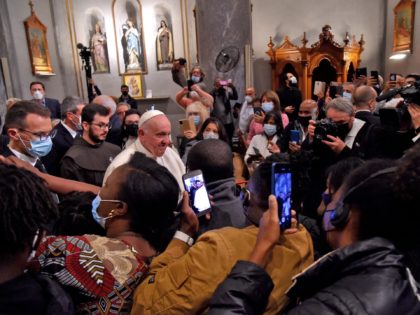 Pope Francis greets attendees after an ecumenical prayer with migrants at the Roman Catholic church of the Holy Cross near the United Nations buffer zone in the Cypriot city of Nicosia, Europe's last divided capital, on December 3, 2021. - Pope Francis appealed for a "sense of fraternity" in an …