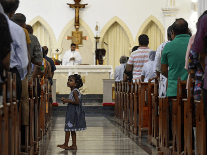 TOPSHOT - Sri Lankan Catholic devotees pray during a mass at the St. Theresa's church as the Catholic churches hold services again after the Easter attacks in Colombo on May 12, 2019. - A Sri Lankan province north of the capital was under indefinite curfew on May 14 after the …