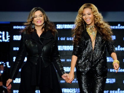 U.S singer Beyonce Knowles and U.S designer Tina Knowles launch their collection House of Dereon, featuring both the Autum-Winter and Summer 2011 collections, in London, during London Fashion week, Saturday, Sept. 17, 2011. (AP Photo/Jonathan Short)