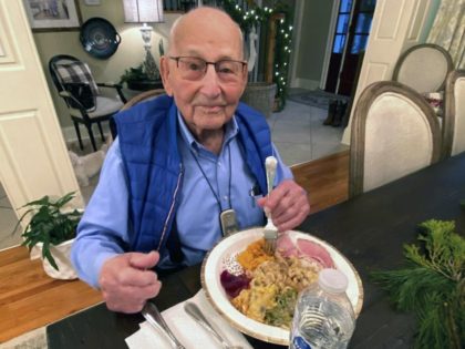 In this photo provided by Holly McDonald, World War II veteran Major Wooten enjoys his Thanksgiving dinner with family in Madison, Ala., on Thursday, Nov. 25, 2021. Wooten, who served in France during the war, will be presented with the French Legion of Honor during his 105th birthday party on …