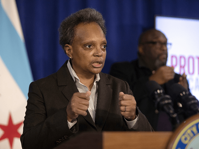 Chicago Mayor Lori Lightfoot speaks during a press conference at City Hall, Tuesday, Dec. 21, 2021, in Chicago. The city will require proof of coronavirus vaccination at restaurants, bars, gyms and other indoor venues, as the rapidly spreading omicron variant drives a spike in COVID-19 infections, Mayor Lightfoot said Tuesday. …