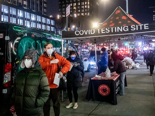 People wait on line to get tested for COVID-19 on the Lower East Side of Manhattan, Tuesda