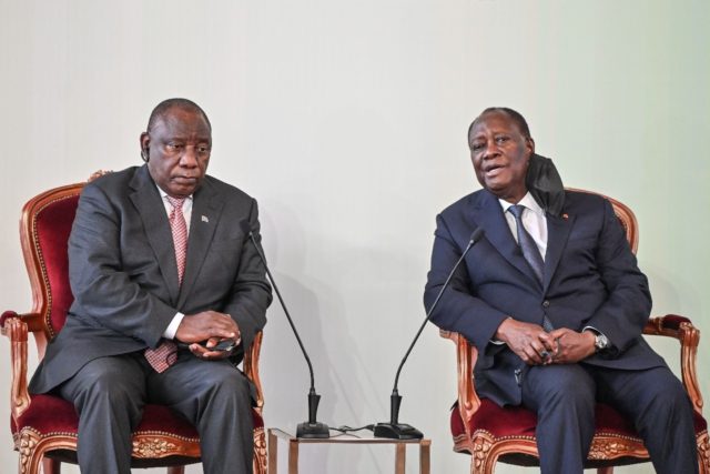 South Africa's President Cyril Ramaphosa (left) deplores 'unfair' travel bans imposed on his country, after meeting his Ivorian counterpart Alassane Ouattara (right)