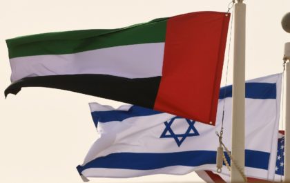 In his file photo taken on August 31, 2020, the Emirati, Israeli and US flags fly at the Abu Dhabi airport at the arrival of the first-ever commercial flight from Israel to the UAE