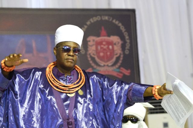 Inching closer... the king of Benin, or Oba, dances to celebrate the signing of the deed o