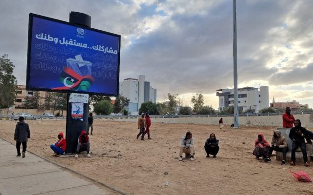 A billboard in the capital Tripoli urges Libyans to vote in a presidential election later