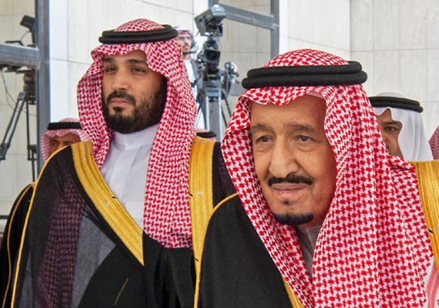 A picture provided by the Saudi Royal Palace on November 20, 2019 shows King Salman (R) ar