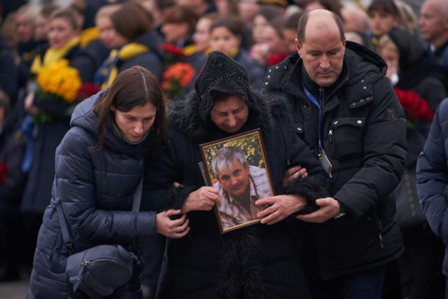 Relatives and colleagues attend a tribute ceremony in January 2020 at Kiev's Boryspil airp