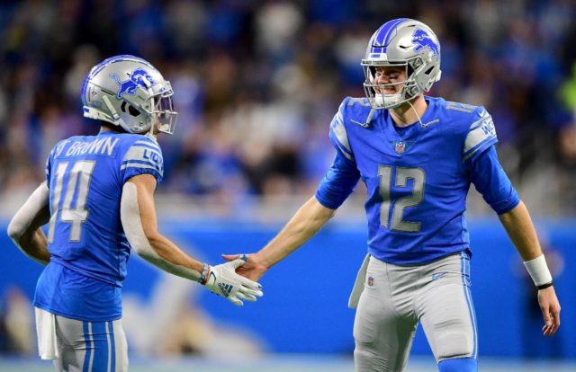 Detroit's Amon-Ra St. Brown and Tim Boyle celebrate a play in the Lions' NFL upset win ove
