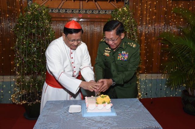 Charles Bo (L) met junta chief Min Aung Hlaing on Thursday to hear Christmas carols and "t