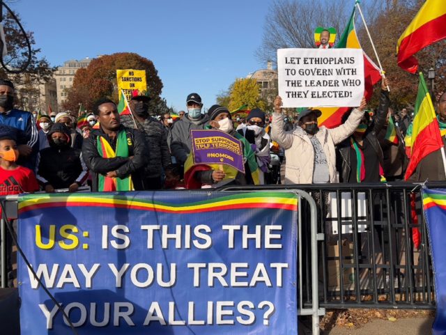 Protesters denounce President Joe Biden's pressure on Ethiopia in a rally outside the Whit