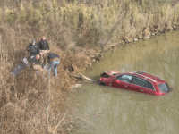 PHOTOS: Kentucky Man Rescues ‘Trapped’ Motorist After SUV Crashes into Creek, Authorities Say