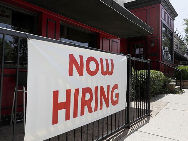 Sherlock's, a pub in Addison, Texas, has a sign out front that reads, "Now Hiring", Friday