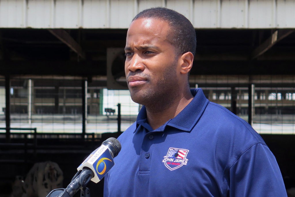 FILE - In this Monday, June 22, 2020, file photo, Republican U.S. Senate candidate John James speaks at Weir Farms in Hanover Township, Mich. First-term Democratic Sen. Gary Peters of Michigan is trying to hang onto his seat. The low-key, understated, maybe even “boring” senator is betting voters care more about his effectiveness as he desperately fights to keep a seat his party is counting on to take the Senate majority. Peters is finding it tougher to shake Republican John James. Michigan has something it has not seen in 20 years: a competitive Senate contest. (AP Photo/David Eggert, File)