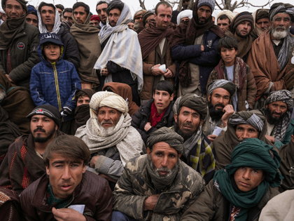 Hundreds of Afghan men gather to apply for the humanitarian aid in Qala-e-Naw, Afghanistan, on Dec. 14, 2021. As winter deepens, a grim situation in Afghanistan is getting worse. Freezing temperatures are compounding the misery from the downward spiral that has come with the fall of the U.S.-backed government and …