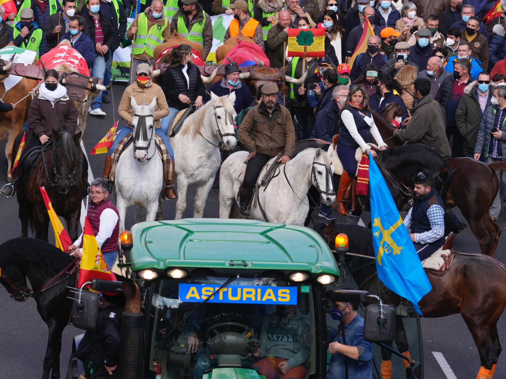 People on horseback follow a tractor during a march in defence of Spanish rural areas during a protest in Madrid, Spain, Sunday, Jan. 23, 2022. Members of rural community are demanding solutions by the government for problems and crisis in the Rural sector. (AP Photo/Paul White)