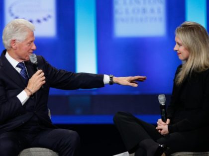 NEW YORK, NY - SEPTEMBER 29: U.S. President Bill Clinton speaks as Elizabeth Holmes, founder and CEO of Theranos, listens during the closing session of the Clinton Global Initiative 2015 on September 29, 2015, in New York City.