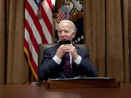 President Joe Biden meets with members of the Infrastructure Implementation Task Force to discuss the Bipartisan Infrastructure Law, in the Cabinet Room at the White House in Washington, Thursday, Jan. 20, 2022.