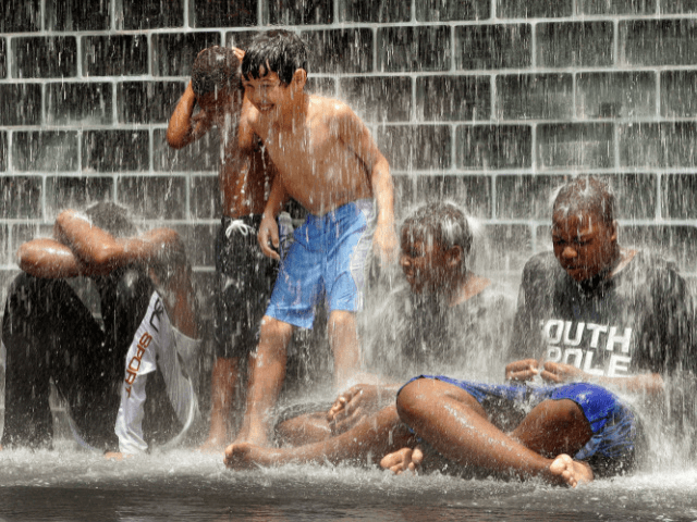 CHICAGO - JUNE 24: Kids play in the water at Crown Fountain in Millennium Park June 24, 20