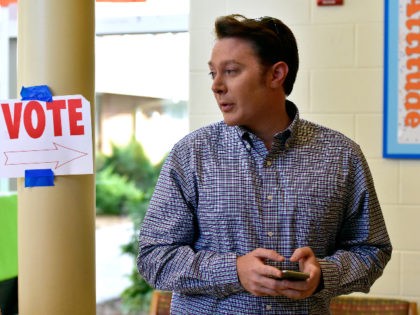 CARY, NC - NOVEMBER 04: Clay Aiken, Democratic candidate for U.S. Congress in North Carolina's Second District, waits in line to vote in the midterm elections on November 4, 2014 at Mills Park Elementary School in Cary, North Carolina. Aiken, a former "American Idol" contestant, is running for political office …