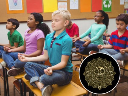 Pupils meditating on classroom desks and Aztec image