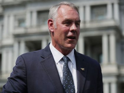 WASHINGTON, DC - AUGUST 16: Interior Secretary Ryan Zinke talks to journalists outside the White House West Wing before attending a cabinet meeting with President Donald Trump August 16, 2018 in Washington, DC. Zinke said the historic wild fires in the west are caused by mismanaged public lands and "environmental …