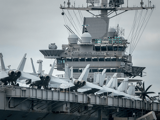 Aircraft parked on the flight deck of the US warship USS Harry S. Truman are pictured as the ship is anchored in The Solent on October 8, 2018 near Portsmouth, England. The nuclear powered aircraft carrier, named after the 33rd President of the United States with a crew of more …