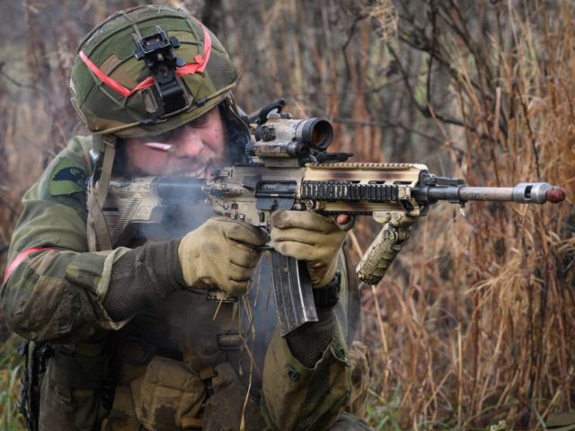 ELVAL, NORWAY - NOVEMBER 03: A shell case is seen as it is ejected from the gun of a Norwegian soldier as he attempts to storm an opposing British Army position, during the live exercise on November 3, 2018 in Elval, Norway. 2018 has been a busy year for the …