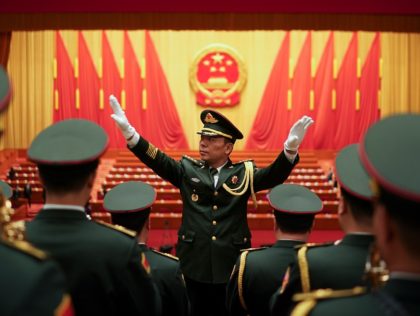 BEIJING, CHINA - MARCH 05: Chinese military conductor gestures as he instructs his music b