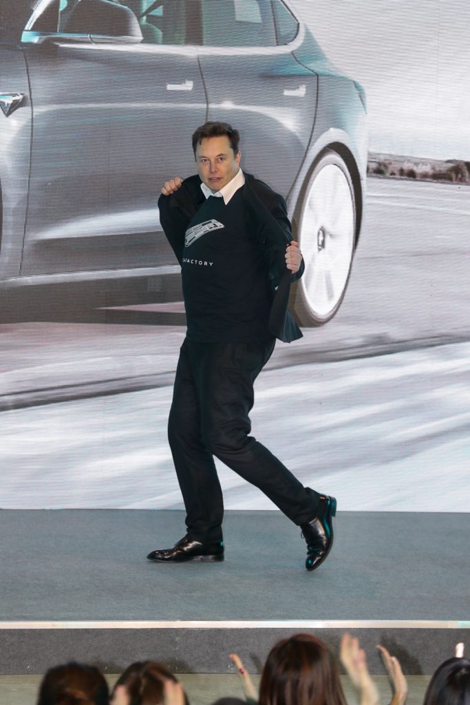 Tesla CEO Elon Musk dances during the Tesla China-made Model 3 Delivery Ceremony in Shanghai. - Tesla CEO Elon Musk presented the first batch of made-in-China cars to ordinary buyers on January 7, 2020 in a milestone for the company's new Shanghai "giga-factory", but which comes as sales decelerate in the world's largest electric-vehicle market. (Photo by STR / AFP) / China OUT (Photo by STR/AFP via Getty Images)