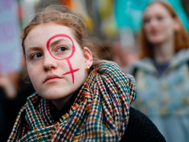 A girl attends the "March4Women" during the International Women's Day in London on March 8, 2020. - Many feminist groups held online campaigns instead of street marches, using hashtags such as #FemaleStrike, #PowerUp and #38InternationalWomensDay to raise awareness of gender inequality. (Photo by Tolga Akmen / AFP) (Photo by TOLGA …