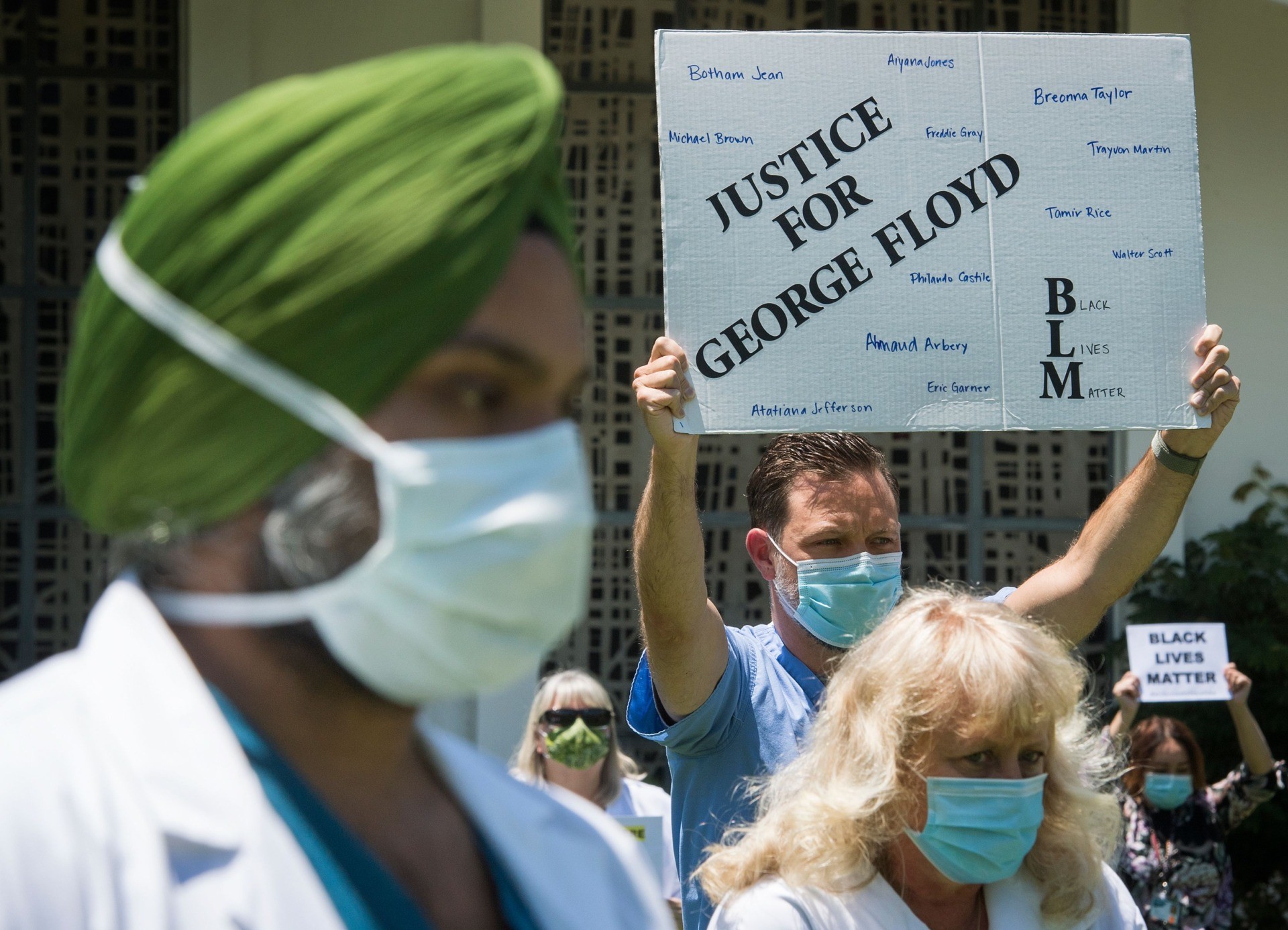 Doctors, nurses and other health care workers participate in a "White Coats for Black Lives" event in solidarity with George Floyd and other black Americans killed by police officers, at the Queen of the Valley Hospital in West Covina, California on June 11, 2020. - George Floyd's killing by a police officer touched off worldwide protests over racial and social injustice. (Photo by Mark RALSTON / AFP) (Photo by MARK RALSTON/AFP via Getty Images)