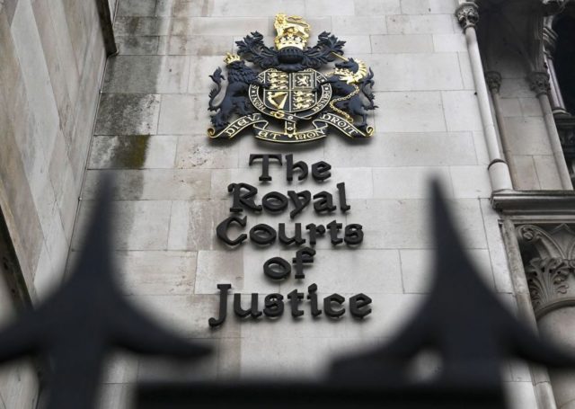A picture shows the front of the Royal Courts of Justice, home to the High Court, in Londo