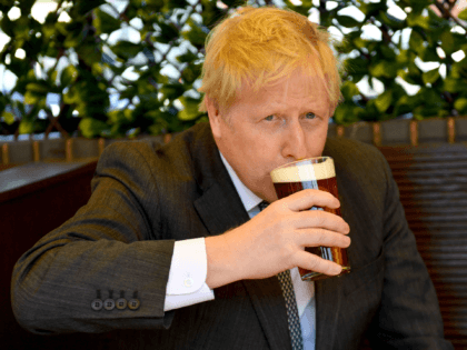 WOLVERHAMPTON, ENGLAND - APRIL 19: Prime Minister Boris Johnson sips a pint in the beer ga