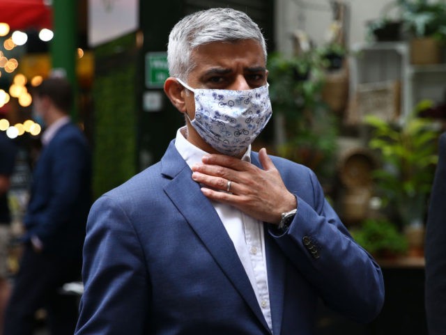 LONDON, ENGLAND - JUNE 27: London Mayor Sadiq Khan gestures as he wears a face mask during a visit to Borough Market on June 27, 2021 in London, England. Khan visited London's Borough Market as it opened to the public on Sundays for the first time in recent history. (Photo …