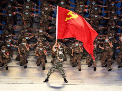 Performers dressed with military uniforms take part in a Cultural Performance as part of the celebration of the 100th Anniversary of the Founding of the Communist Party of China, at the Bird's nest national stadium in Beijing on June 28, 2021. - The 100th anniversary is scheduled for July 1. …