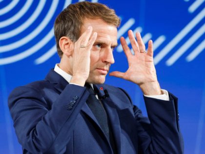 France's President Emmanuel Macron gestures as he speaks during the presentation of "France 2030" investment plan at The Elysee Presidential Palace in Paris, on October 12, 2021. - Hydrogen, semiconductors or electric batteries: Emmanuel Macron details on October 12, 2021, the priority sectors of the "France 2030" plan to "bring …